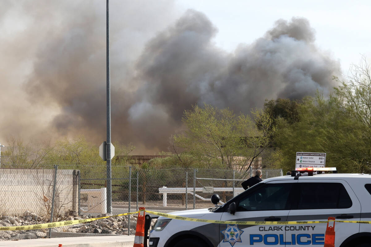 A heavy smoke is seen as firefighters from Clark County and Bureau of Land Management battle a ...