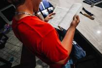Dylan Foster, 15, looks through his grammar book Saturday, April 12, 2025, in Las Vegas. (Madel ...