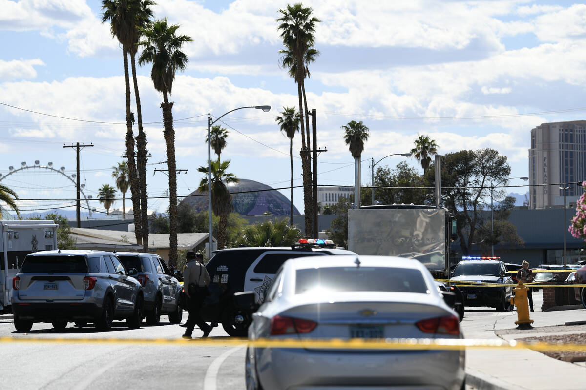 Las Vegas Metropolitan Police investigators inspect the scene of a fatal stabbing on the 1400 b ...