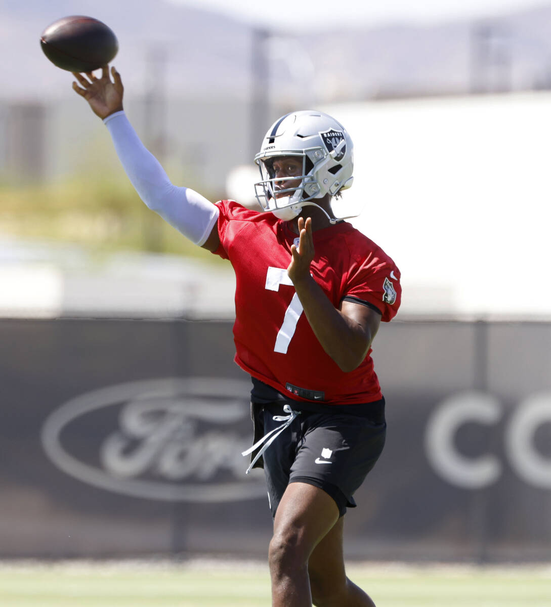 Raiders quarterback Geno Smith (7) throws the ball during organized team activities at the Inte ...