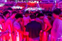 UNLV players gather with head coach Kevin Kruger as they face the Wyoming Cowboys during the fi ...