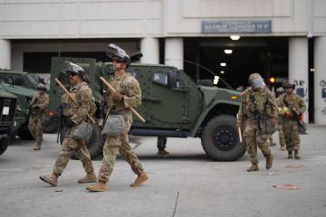 U.S. National Guard are deployed around downtown Los Angeles, Sunday, June 8, 2025, following a ...